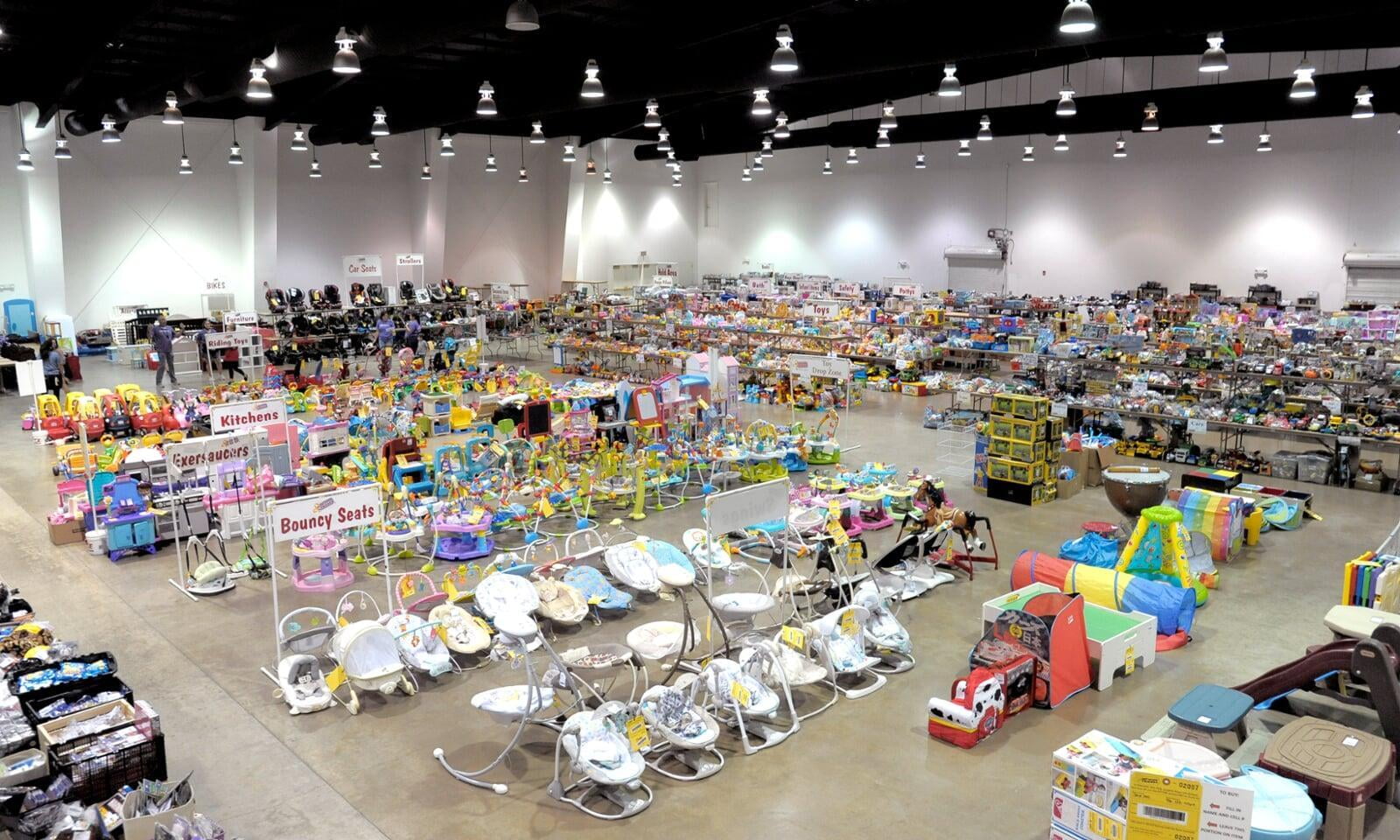 Overview of the sale showing bouncy seats and other merchandise presented.